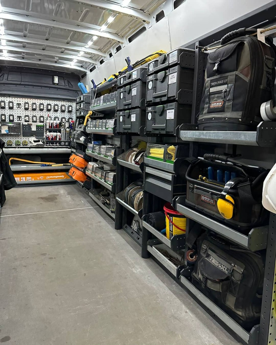 Custom van racking design - van interior with bott Smartvan van racking, shelving and van storage boxes