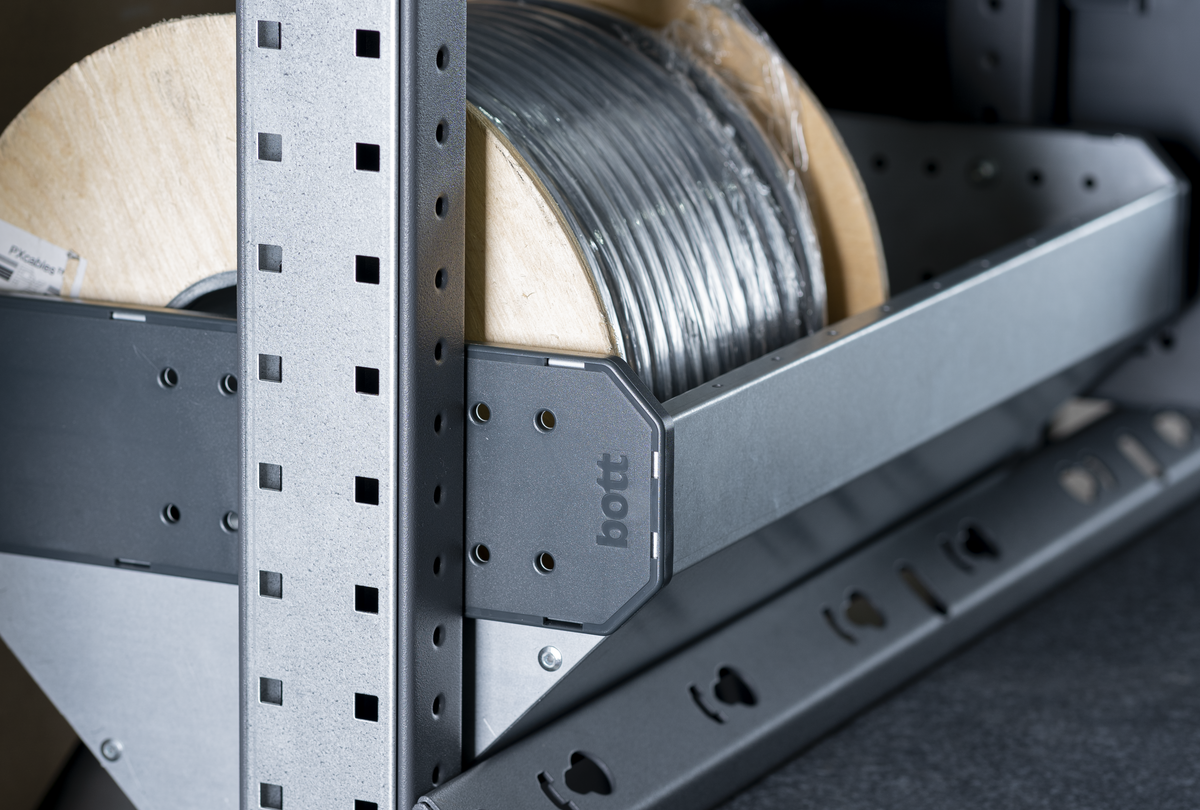 Metal shelf for reels of electrical cable